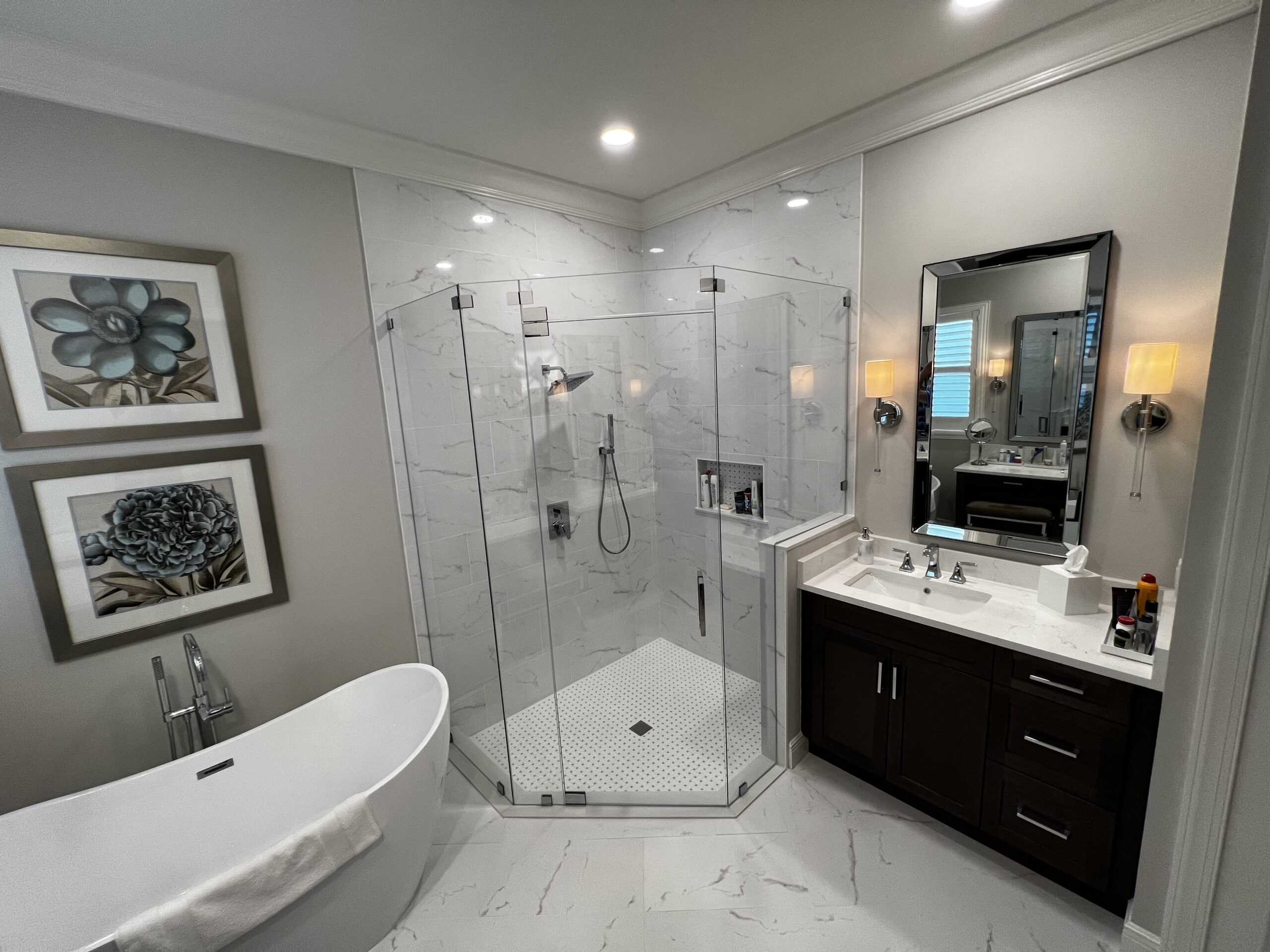 Modern bathroom with glass shower and freestanding tub
